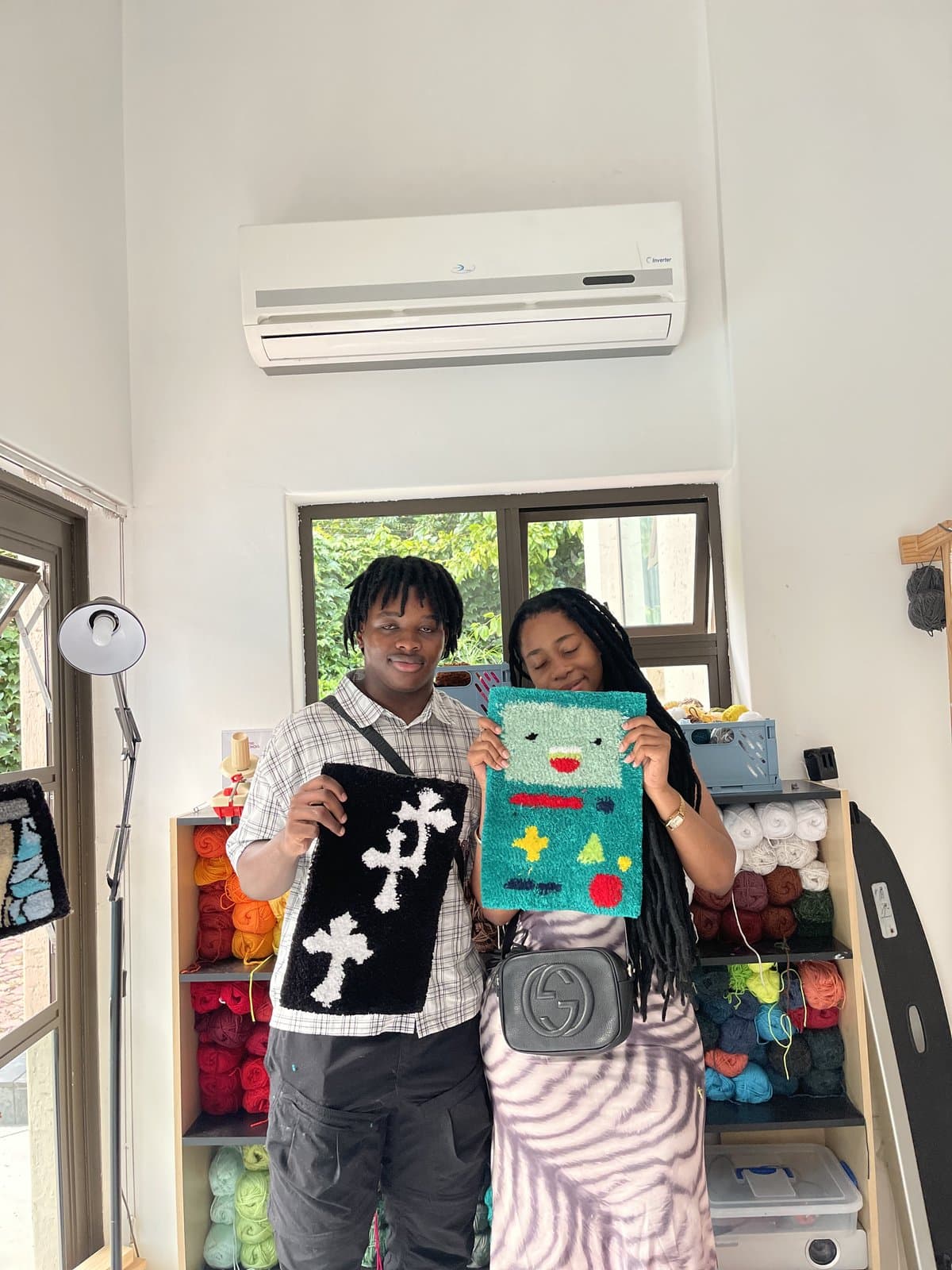 Couple holding matching cross-shaped tufted patches