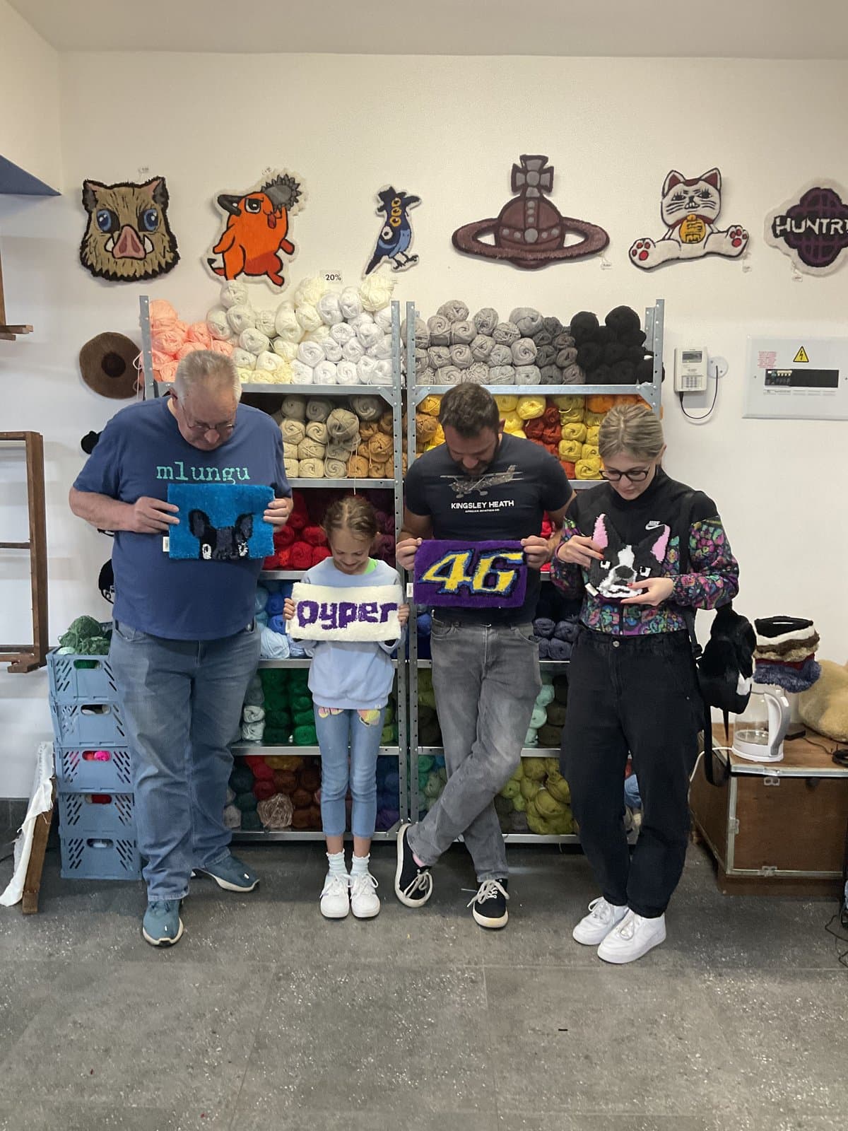 Group of visitors posing together in the studio
