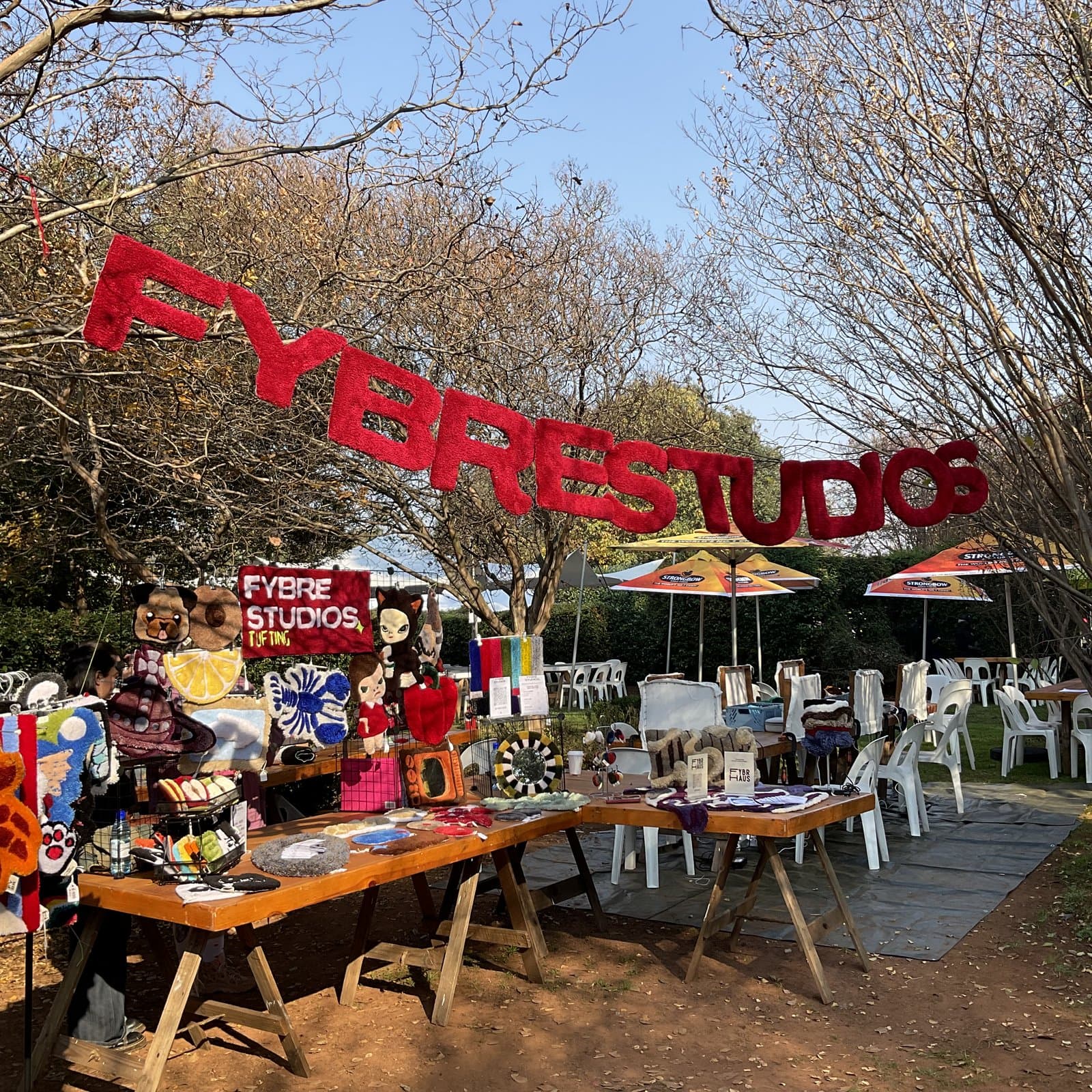 Wide view of the Fybre Studios stall at an outdoor market